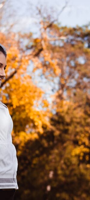 young woman stretching outdoors