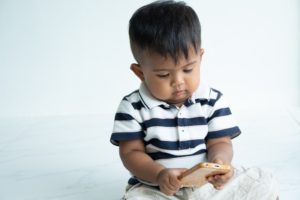 Toddler Looking at Cell Phone