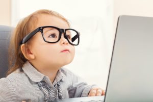 Child struggling ot read with glasses on