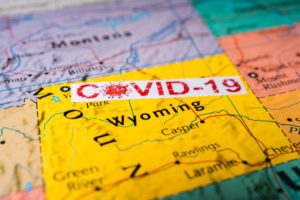 photo of yellow Wyoming Map with Covid label