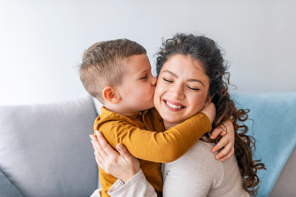 Boy Kissing Mom On Cheek Wyoming Department Of Health