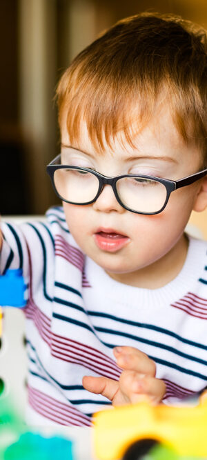 boy with blocks in preschool