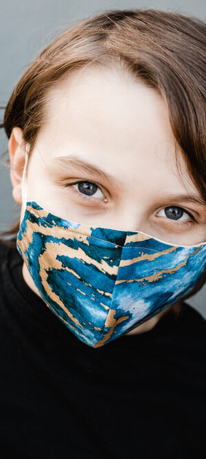 boy with colorful face covering