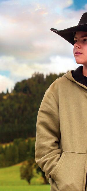 boy with cowboy hat and mountains