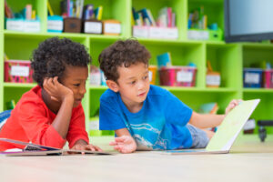 boys with book at preschool