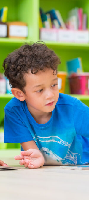 boys with book at preschool