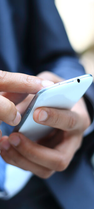 business guy dialing on smartphone