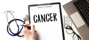 cancer on medical clipboard