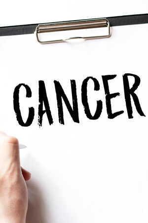 cancer on medical clipboard