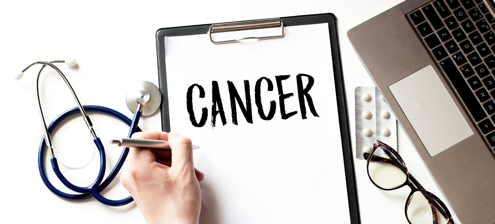 cancer on medical clipboard