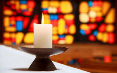 candle with church window