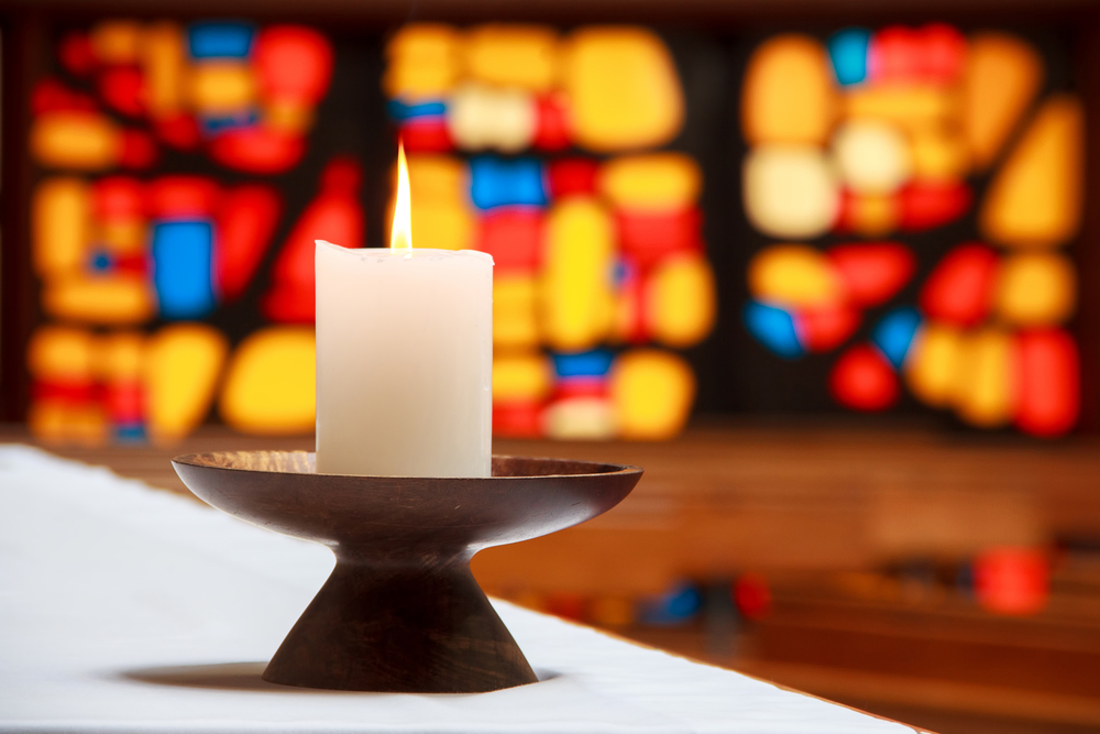 candle with church window