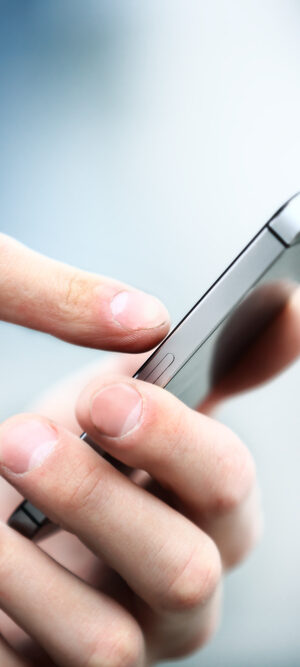 close up of hands using smartphone
