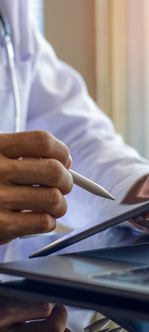 close up telehealth provider with computer