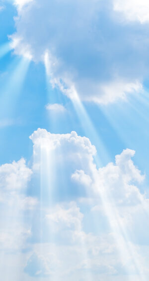 cloudy blue sky with sunbeams