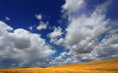 cloudy sky with low hills