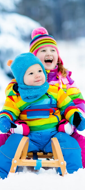 colorful little kids playing in snow