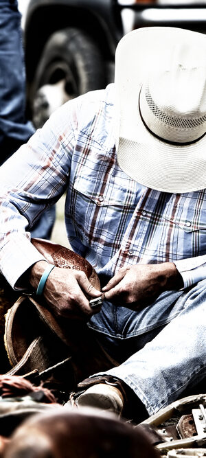 cowboy at a rodeo with gear