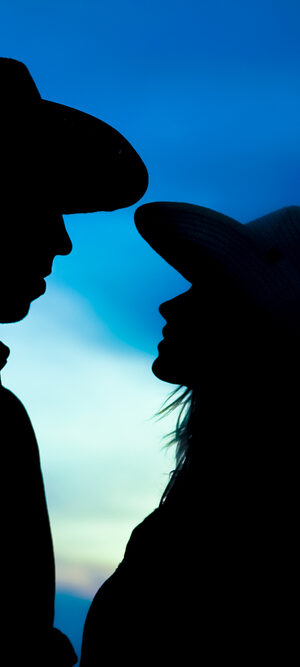 cowboy couple with blue background