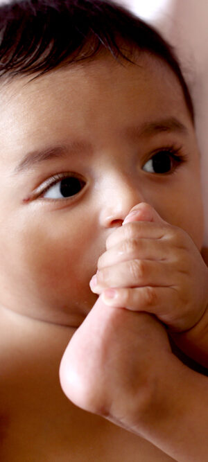 cute baby eating his toes