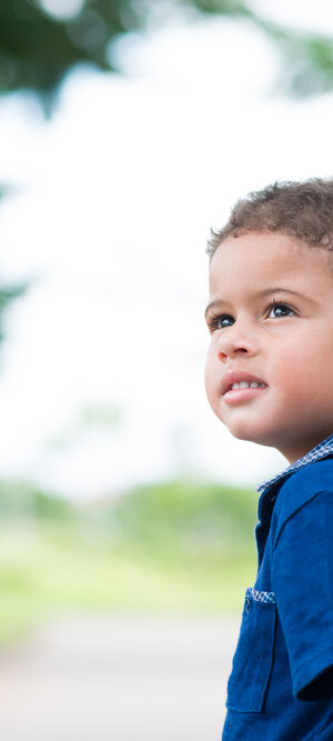 cute little boy walking outdoors