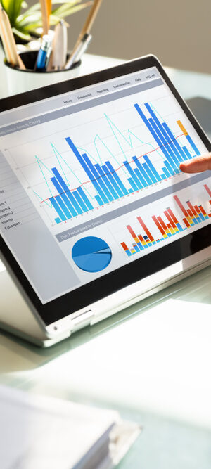 data and bar graphs on laptop