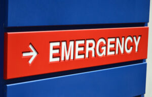 emergency on sign with blue