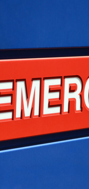 emergency on sign with blue