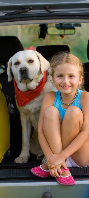girl and dog ready for a trip
