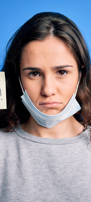girl holding virus alert note