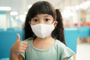 girl with face covering