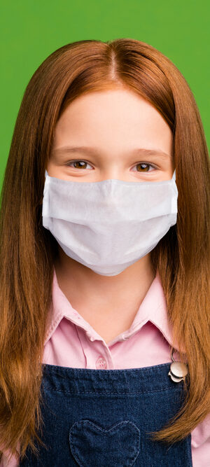 girl with red hair and face covering