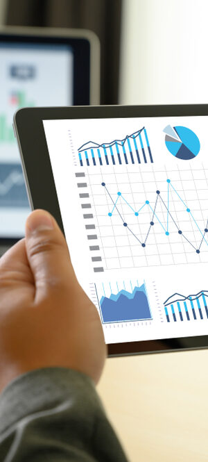 graphs and data on tablet and computer