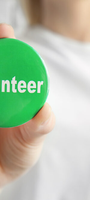 green volunteer button