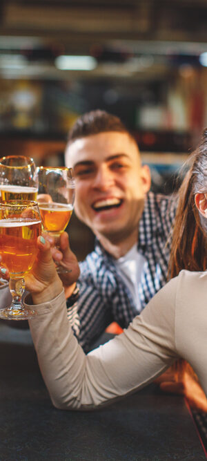 group in a bar taking selfie