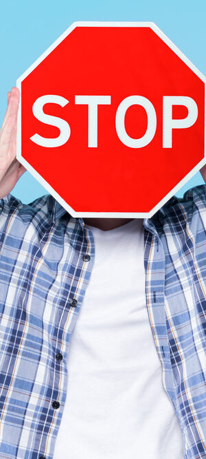 guy holding stop sign