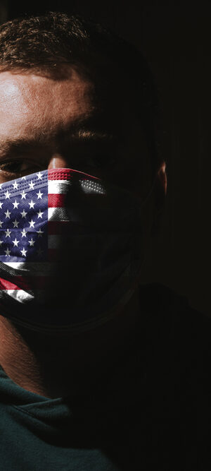guy with flag face covering