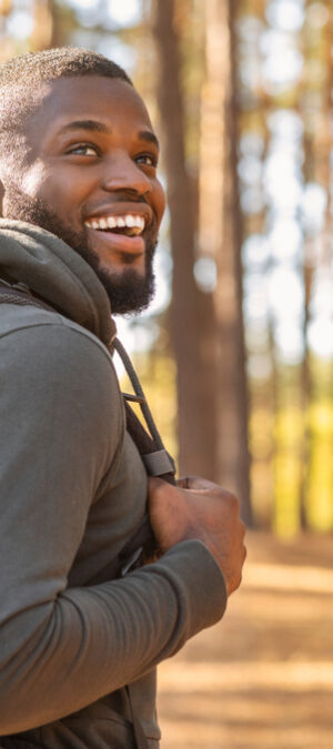 guy with pack on hiking trail