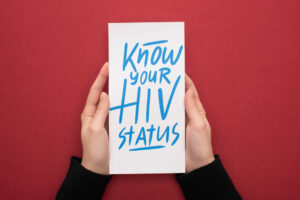hands holding HIV status message