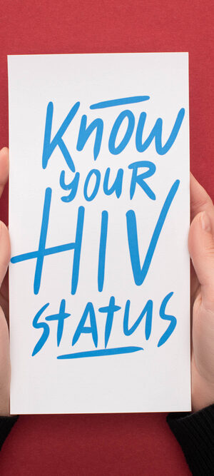 hands holding HIV status message