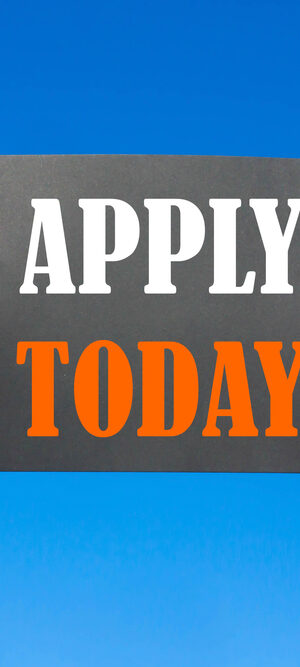 hands holding apply today sign