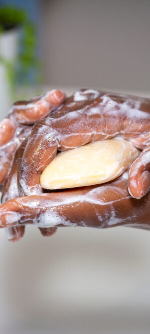 hands washing with bar soap