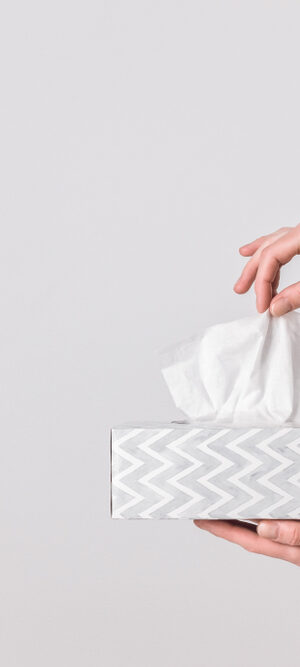 hands with tissue box