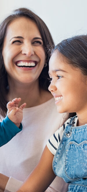happy family sitting together indoors