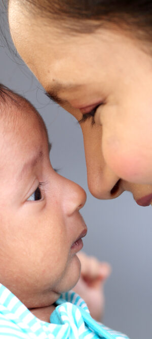 happy mom with newborn baby close up