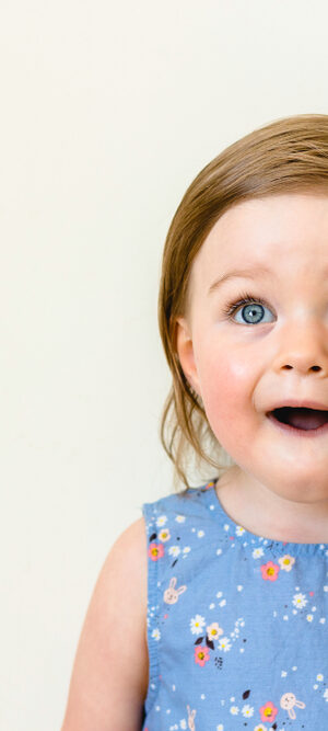 happy surprised toddler girl