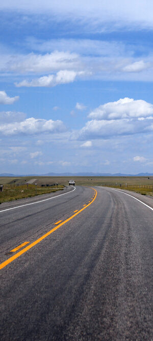 highway in valley with hills