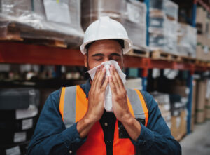 ill worker with tissue