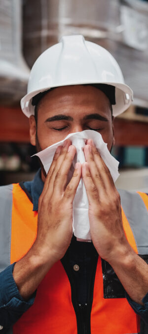 ill worker with tissue