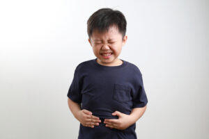 kid with upset stomach